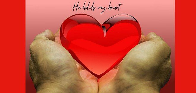 Hands holding a heart