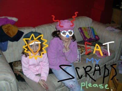 'Eat My Scraps. Please' is written on a photograph of two young girls. They do not look happy. Someone has doodled over their faces to maintain anonymity.