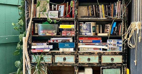 The image is of an old bookcase which sits in the corner of my favorite cafe