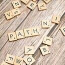 A table is shown with letter blocks covering the table, a series of them spelling out the word "Path" for the viewer to see as they look down at the table