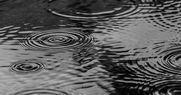 A street being pelted by falling raindrops