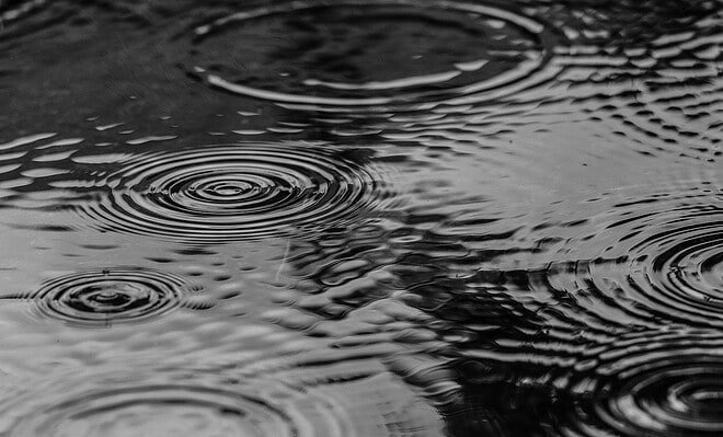 A street being pelted by falling raindrops