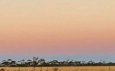 The image shows the color of the dawn sky above the western horizon