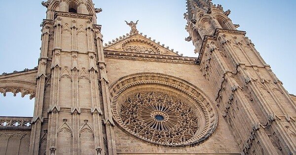 A tall cathedral building stretched towards the blue skies