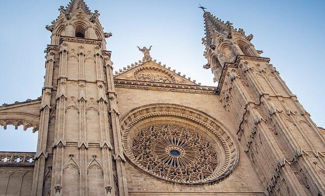 A tall cathedral building stretched towards the blue skies