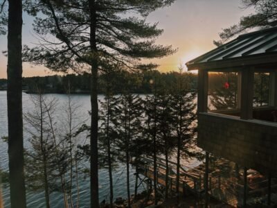 Image of a cabin in Maine on the ocean overlooking a sunset