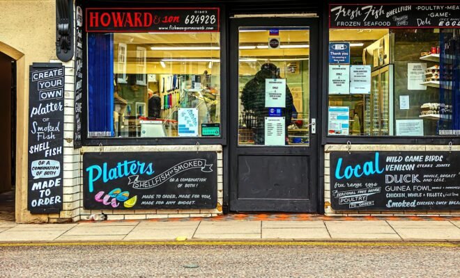 A fishmonger's shop with the title Howard and Son
