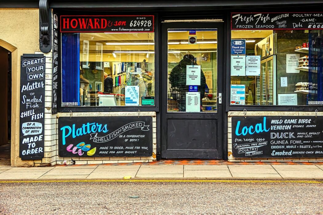 A fishmonger's shop with the title Howard and Son