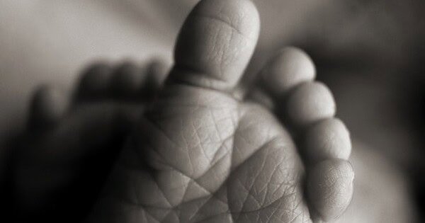 Black and white picture of baby feet