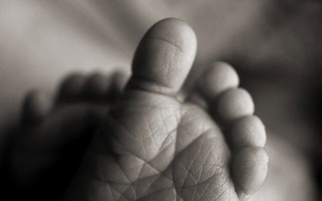 Black and white picture of baby feet