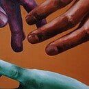 Four multi-colored hands reaching for each other against an orange background