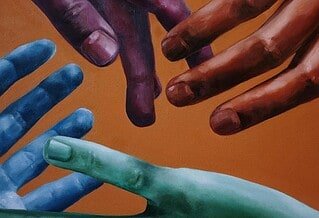 Four multi-colored hands reaching for each other against an orange background