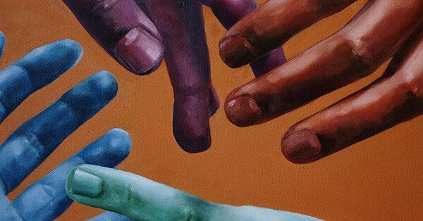 Four multi-colored hands reaching for each other against an orange background