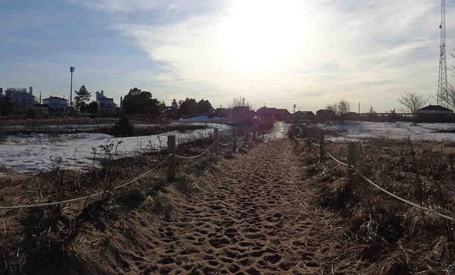 Image of a beach walkway as the sun is setting