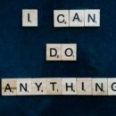 A dark blue/black background is shown, and included scrabble pieces that spell out the words "I can do anything" for viewers to see.