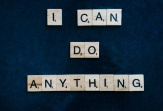 A dark blue/black background is shown, and included scrabble pieces that spell out the words "I can do anything" for viewers to see.