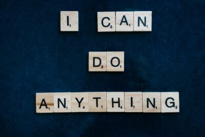 A dark blue/black background is shown, and included scrabble pieces that spell out the words "I can do anything" for viewers to see.