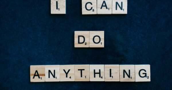 A dark blue/black background is shown, and included scrabble pieces that spell out the words "I can do anything" for viewers to see.