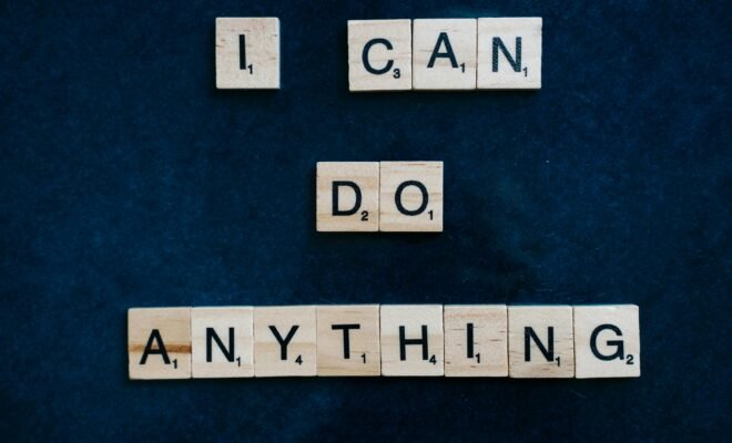 A dark blue/black background is shown, and included scrabble pieces that spell out the words "I can do anything" for viewers to see.
