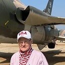 Man standing next to a plane