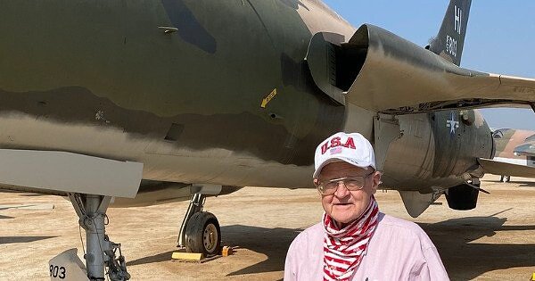 Man standing next to a plane