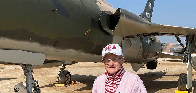 Man standing next to a plane