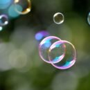 Bubbles with reflecting colorful light floating.