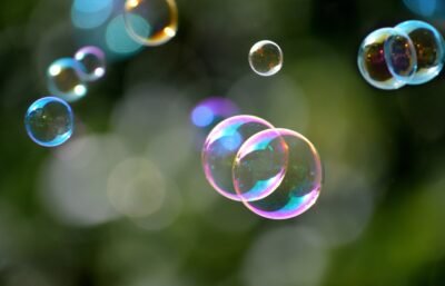 Bubbles with reflecting colorful light floating.