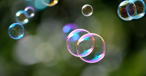Bubbles with reflecting colorful light floating.