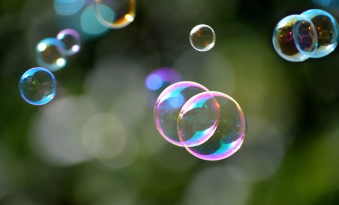 Bubbles with reflecting colorful light floating.