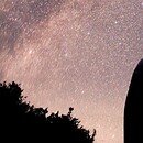 person sitting watching the night sky