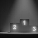 podium with lit numbers on a black and white background