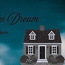 Image of a black and white house against a dream-like night sky with the text "Living the Dream by Lexi Graham"
